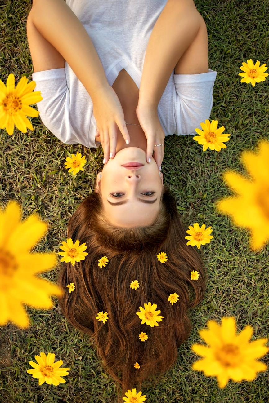 Person relaxing while arranging flowers